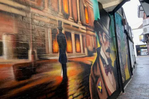 Katy Lewis/BBC Mural in Sovereign Way, an alley between Market Place and Chequer Street, St Albans