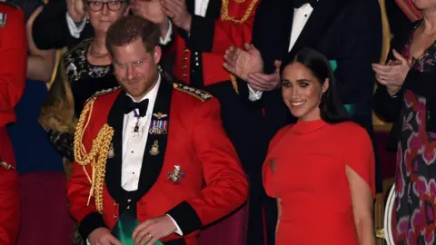 Getty Images Prince Harry and Meghan received a standing ovation at the event