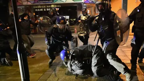 PA Media Police tackle protesters