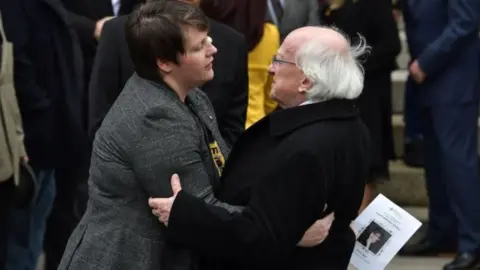 Getty Images Irish President Michael D Higgins consoles Ms McKee's partner Sara Canning