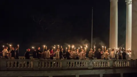 Getty Images Torch march of white nationalists in Charlottesville on 11 August, 2017