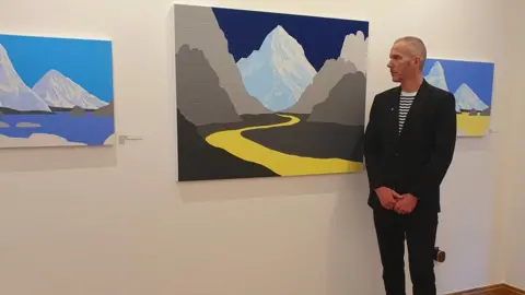 Grove Square Galleries David Wightman stood beside his artworks