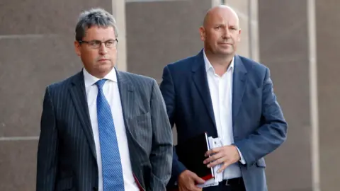 PA Media Paul Clark (right) and David Whitehouse (left) leave Glasgow Sheriff Court in 2015