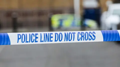 SOPA Images/Getty Police tape