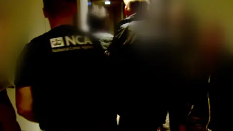 NCA Arrested man led away