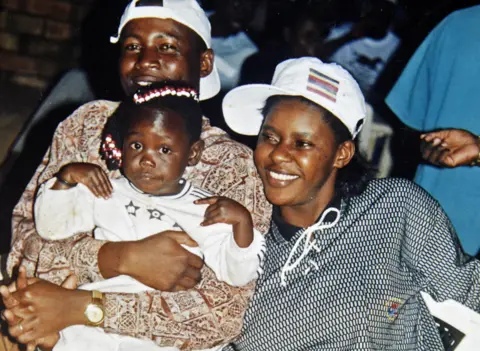Susan Kigula A young Susan Kigula with partner Constantine and young daughter.