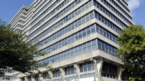 LDRS Alexander House which is a concrete and glass tower block.