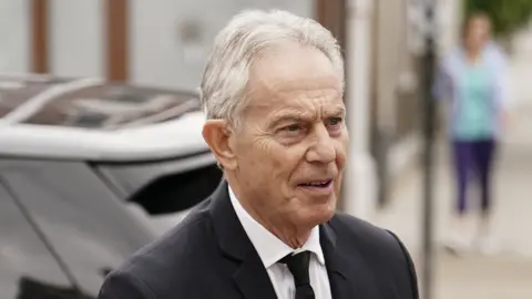 PA Media Tony Blair arriving for the Requiem Mass to celebrate the life of Baroness Margaret McDonagh at St Boniface RC Church in Mitcham, London in July