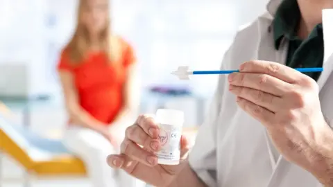 Science Photo Library Patient preparing for cervical screening