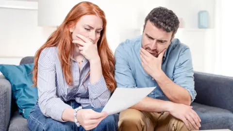 Couple looking at a bill