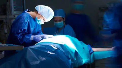 Getty Images Surgeon performing operation