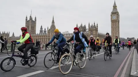 PA Media Protesters cycle through London