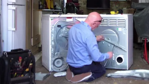 BBC Engineer checks dryers