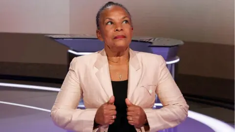 Getty Images France's former Justice Minister and candidate for the 2022 presidential election Christiane Taubira poses as she participates in a news broadcast of France 2 TV channel in Paris, on January 15, 2022