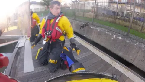 RNLI cat jumping from lifeboat