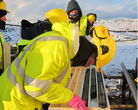 Rock samples being dug out to examine