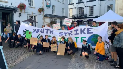 Parents and grandparents join young activists at a climate change protest in Monmouth