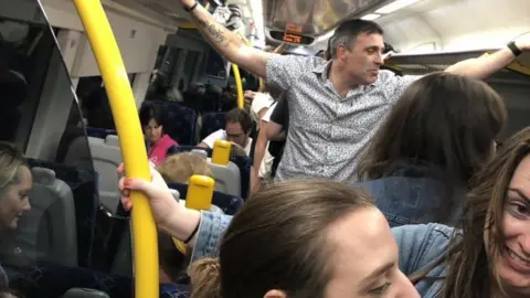 Lesley Eadie Crowded passenger train