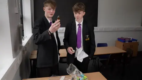 BBC News School pupil holding a vape