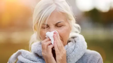 Getty Images Woman with flu