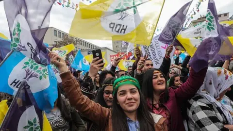 Getty Images Supporters of Turkey's main pro-Kurdish HDP party cheer during a campaign rally in Ankara in 2019