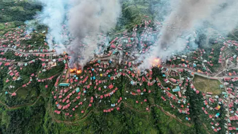 Getty Images Smoke and fires from Thantlang, Chin State, caused by shelling from military forces, according to local media - October 2021