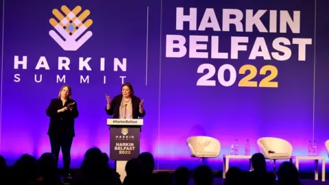 Department for Communities Deirdre Hargey speaking at the conference