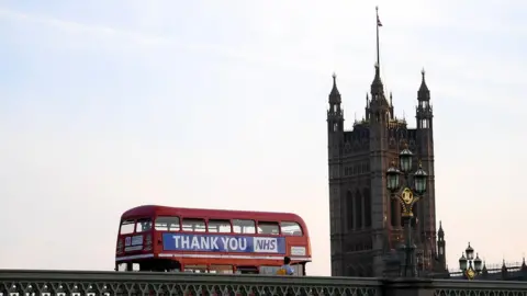 Getty Images London bus drives past Big Ben