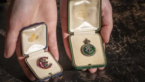 National Trust Pair of Edwardian brooches with a cipher of Edward VII
