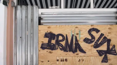 Getty Images Boarded up building with graffiti