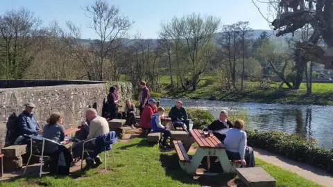 Drinkers along the river