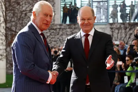 Reuters German Chancellor Olaf Scholz welcomes Britain's King Charles at the Chancellery in Berlin