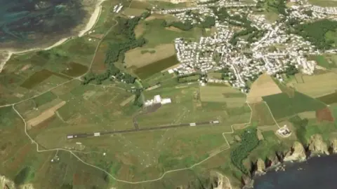 Lucy James Alderney runway