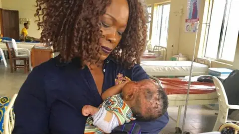 Iby Ikotidem Iby Ikotidem with child