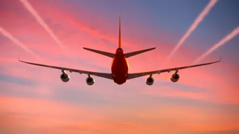 Getty Images Vapour trails behing aircraft