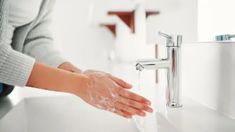 Getty Images Woman washing hands