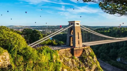 Sion Hannuna/Shutterstock Balloons over Clifton Suspension Bridge