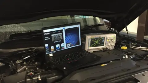 Laptop on car engine