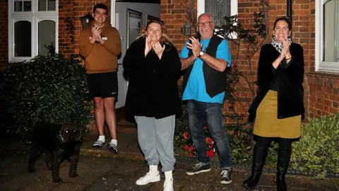 Getty Images Residents in Northampton cheer for the NHS