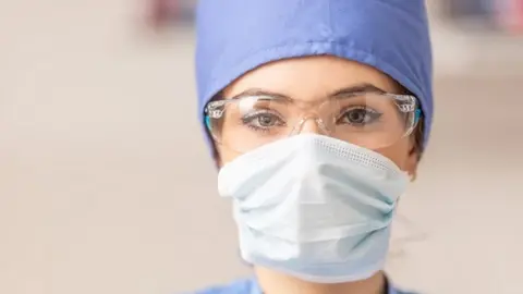 Getty Images A nurse in PPE