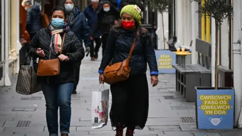Getty Images Women in facemasks Cardiff