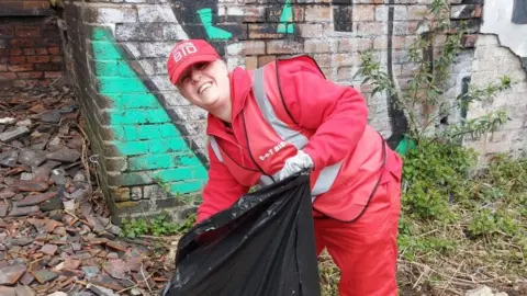 Stoke-on-Trent City Centre BID BID worker litter picking