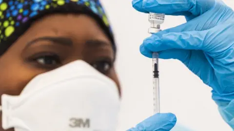 EPA New York nurse prepares Covid vaccine shot