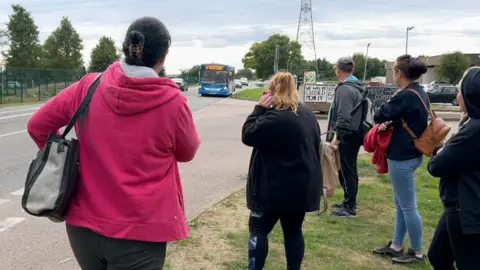 Jon Ironmonger/BBC People waiting for a Stagecoach bus