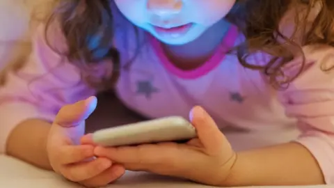 Getty Images Young child with smartphone