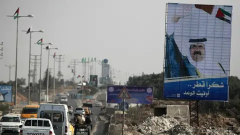 AFP Picture of the former Emir of Qatar, Sheikh Hamad bin Khalifa Al Thani, on display in Gaza City during a visit on 22 October 2012