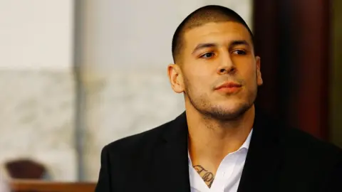 Getty Images Aaron Hernandez sits in the courtroom of the Attleboro District Court in Massachusetts in 2013.