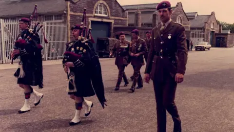 Handout Old Photograph of Jonathan Pape escorting King Charles III