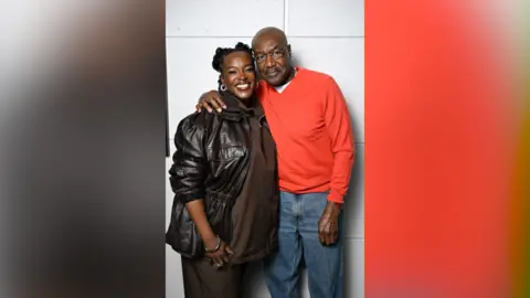 Wunmi Mosaku (left) and Delroy Lindo stand close together for a picture, Delroy has his arm around Wunmi's shoulder