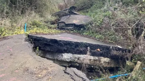 Tarmac that has cracked and raised off the ground at Lyneham